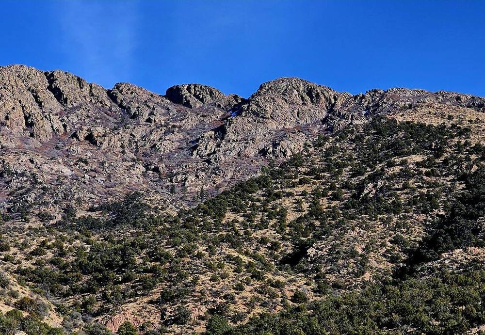 Steep granite ridgeline on the private New Mexico ranch where aoudad hold